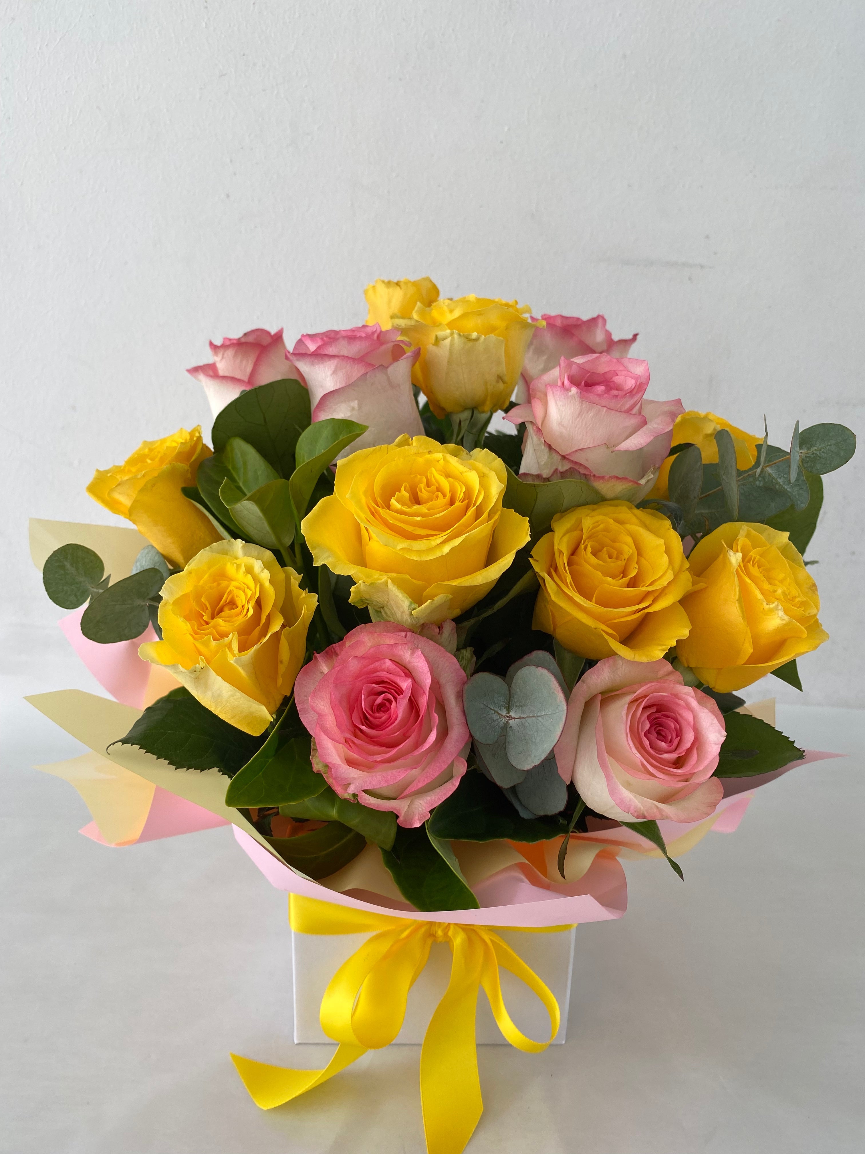 Bouquet of yellow and pink roses