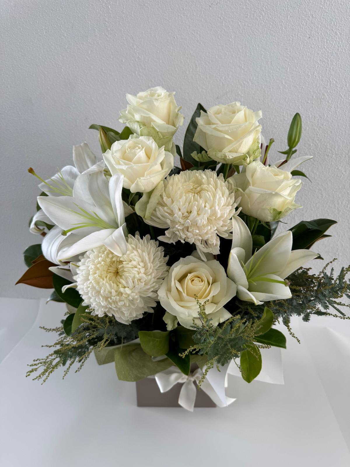 Oriental lillies, disbuds, roses and other seasonal white flowers